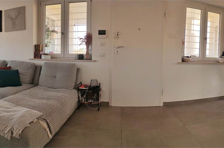 Soggiorno con cucina a vista