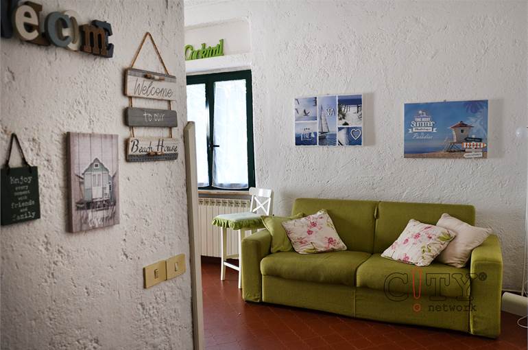 Soggiorno con cucina a vista